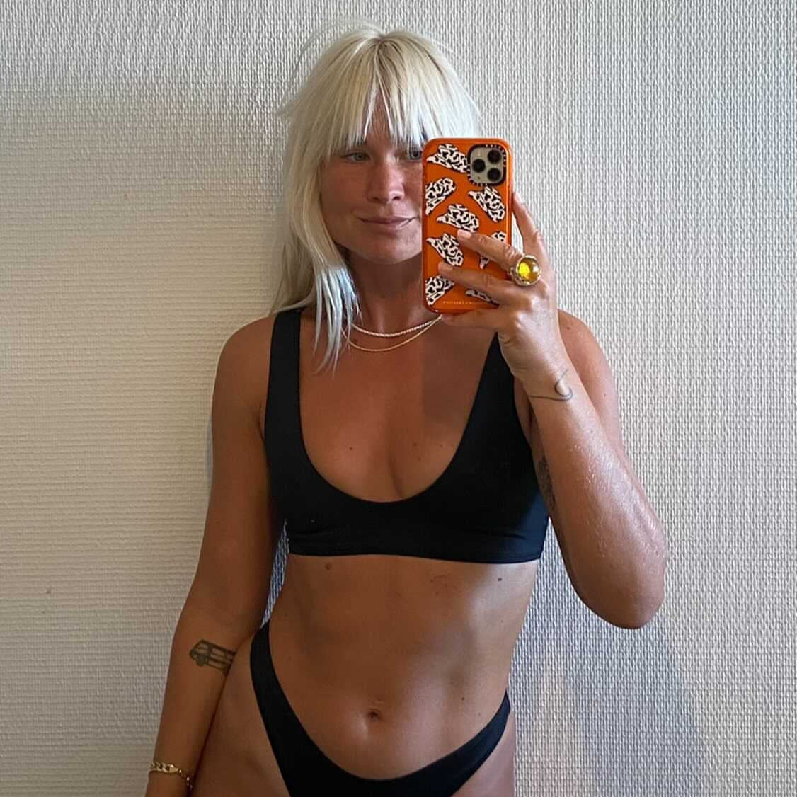 Radiant and strong—Tumla’s true black bikini, worn by a blonde, is designed to keep you comfortable while making a bold fashion statement